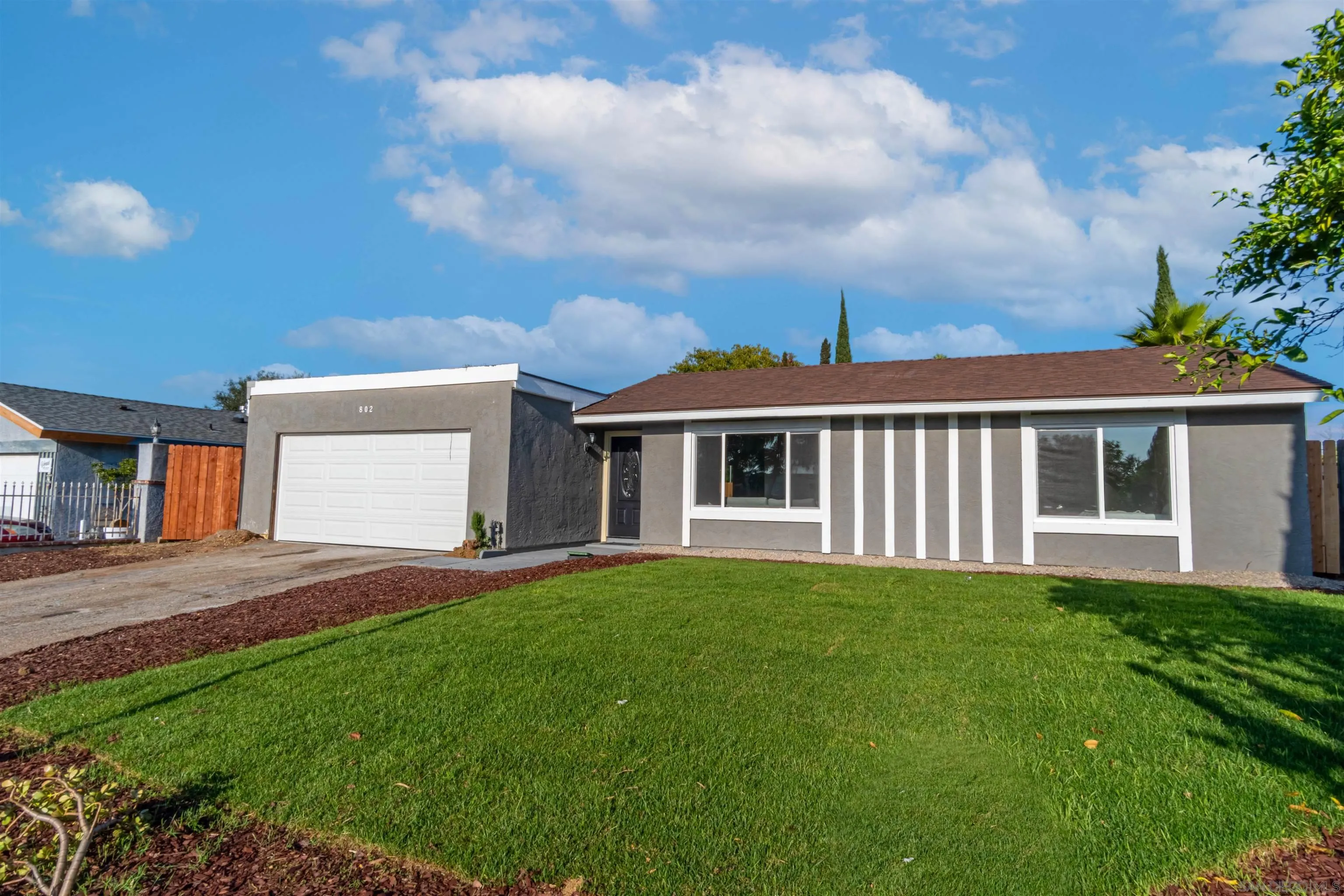 802 El Caminito Road Fallbrook, CA 92028 - Photo 26 of 26 a front view of a house with a garden and yard