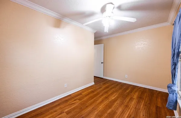 a view of room with wooden floor