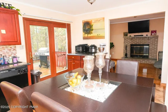 a living room with fireplace furniture and a flat screen tv