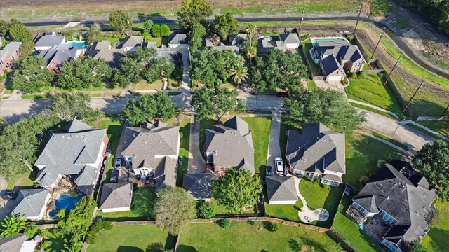 an aerial view of a swimming pool and outdoor space