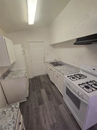 an empty room with a empty space and windows