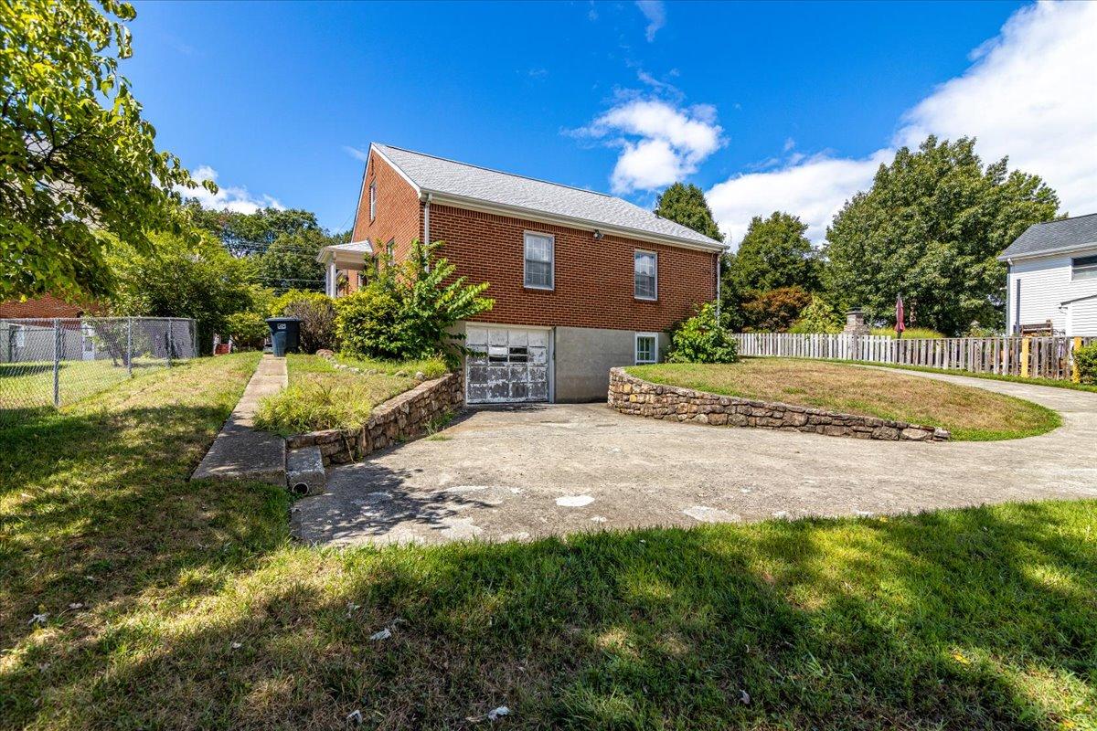 2510 Tillett Road Southwest Roanoke, VA 24015 - Photo 27 of 27 a view of a house with a yard