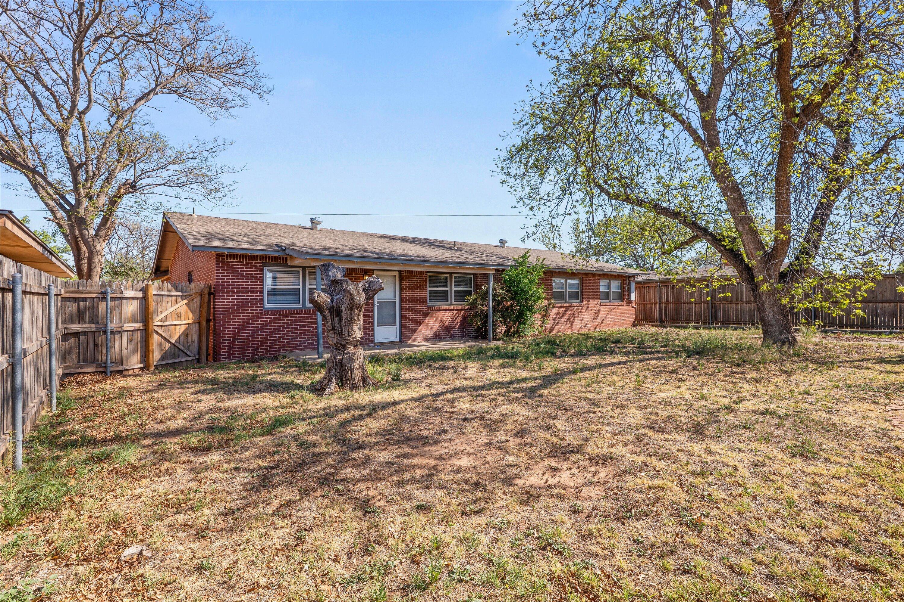 3809 49th Street Lubbock, TX 79413 - Photo 23 of 24 a view of a house with a yard covered in snow