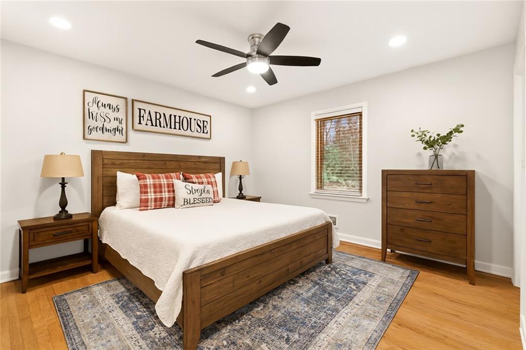 2608 Laurelwood Road Atlanta, GA 30360 - Photo 17 of 45 a bedroom with a bed and a dresser