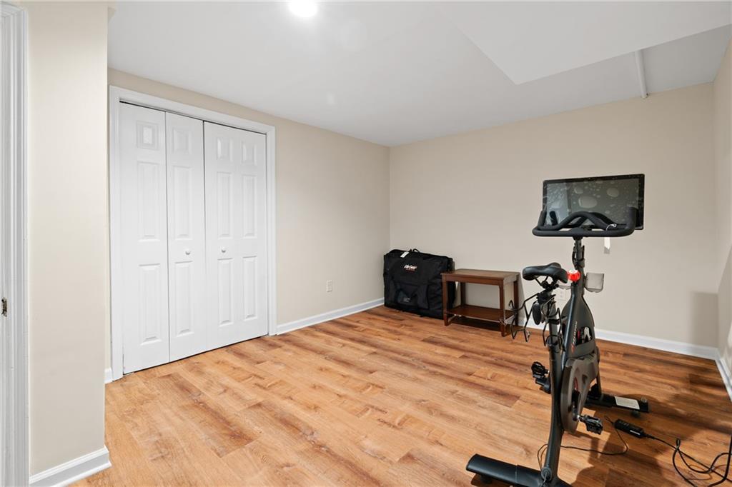 2608 Laurelwood Road Atlanta, GA 30360 - Photo 23 of 45 a bedroom with a bed and a flat tv screen on the table