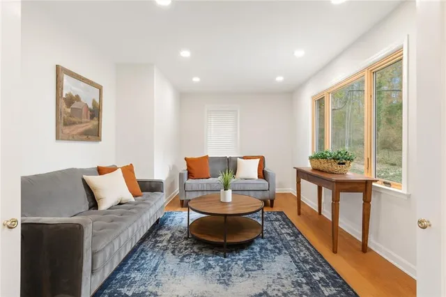 a living room with furniture and a large window