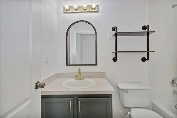 a front view of a house with a garden and plants