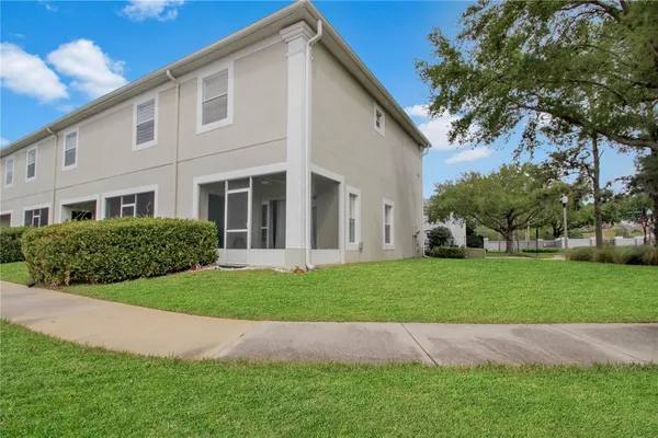 a view of a lake with houses in the back