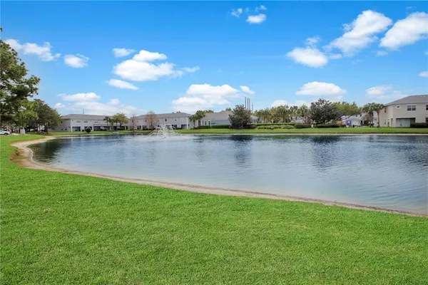a view of a swimming pool with an outdoor space and seating area