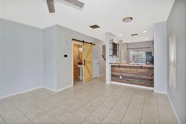 a kitchen with granite countertop white cabinets and stainless steel appliances