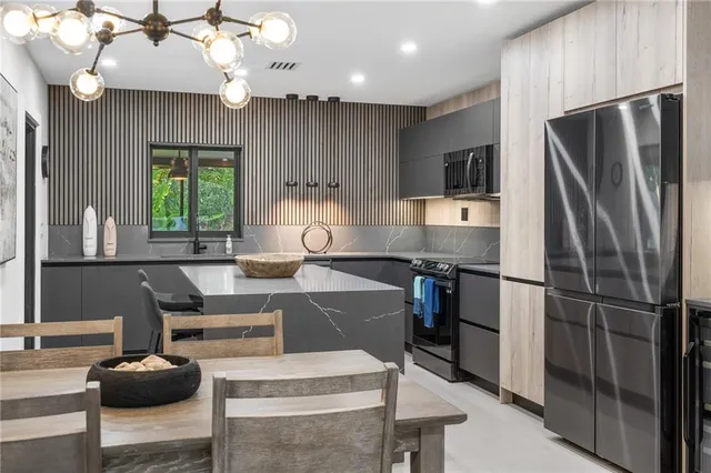 a kitchen with a sink cabinets and window