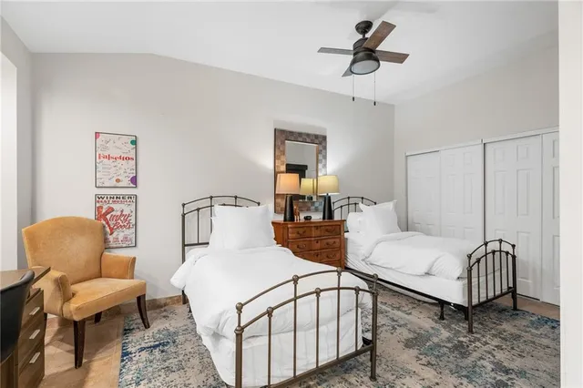 a view of a dining room with furniture and a chandelier