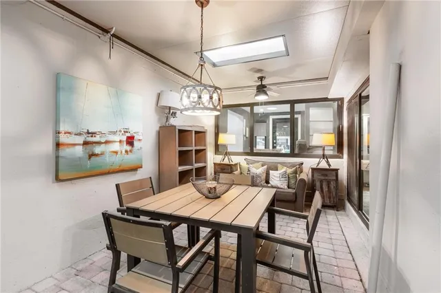 a view of a chair and table in backyard