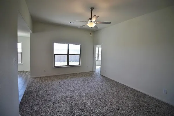 a view of an empty room with a window