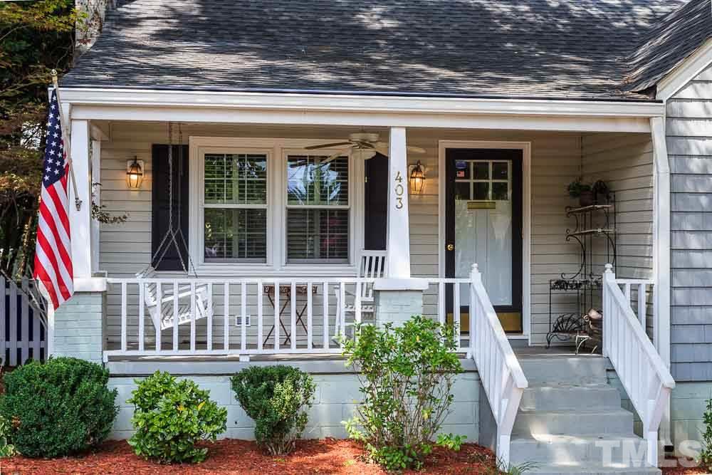403 Pershing Road Raleigh, NC 27608 - Photo 2 of 20 a view of a house with potted plants and a bench