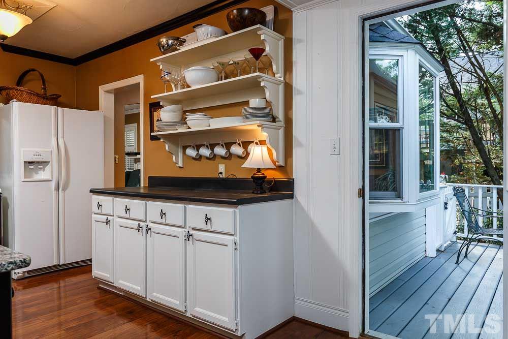 403 Pershing Road Raleigh, NC 27608 - Photo 13 of 20 a view of a wooden door with a balcony
