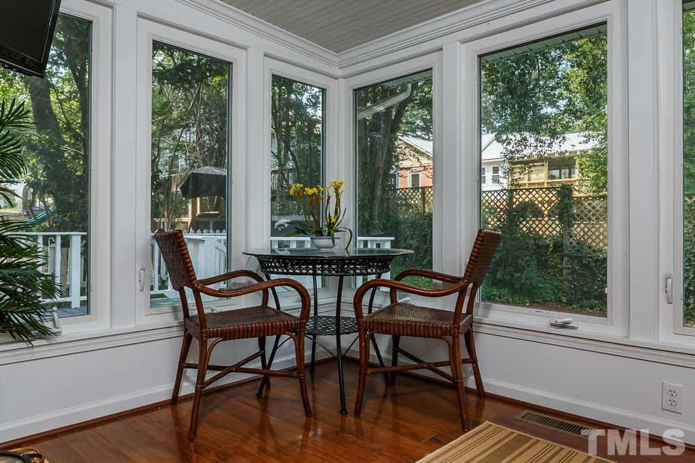 403 Pershing Road Raleigh, NC 27608 - Photo 14 of 20 a view of a dining room with furniture and windows