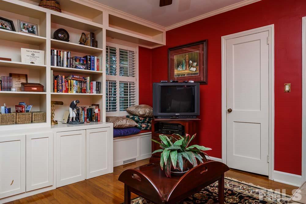 403 Pershing Road Raleigh, NC 27608 - Photo 15 of 20 a livingroom with a workspace