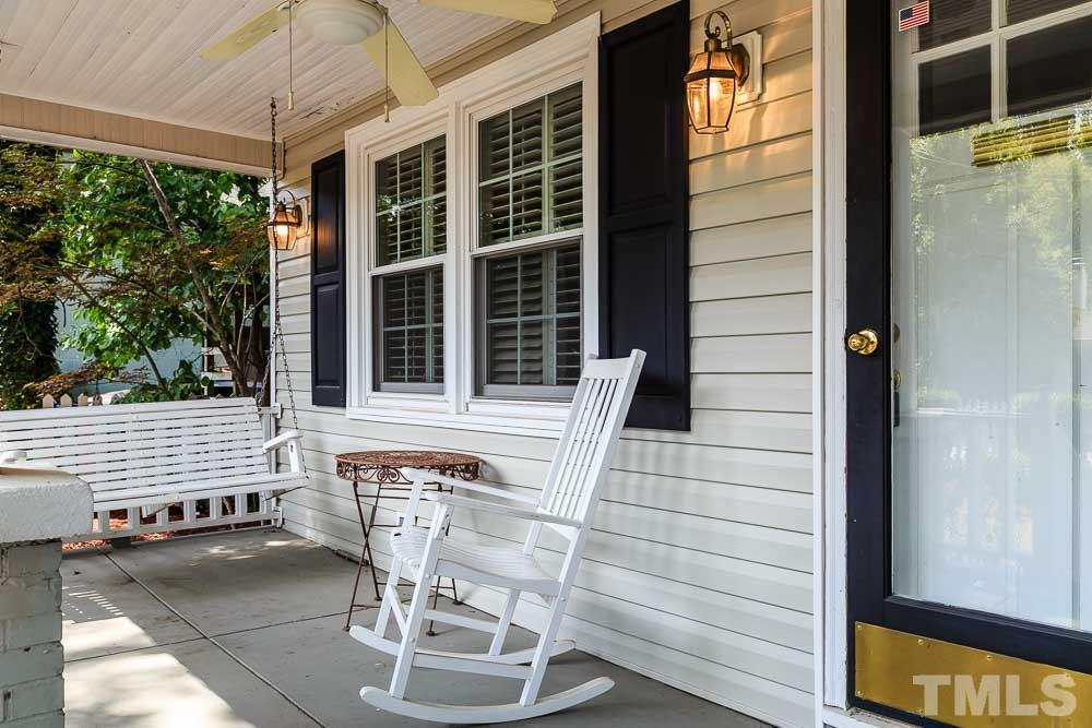 403 Pershing Road Raleigh, NC 27608 - Photo 3 of 20 a balcony with table and chairs