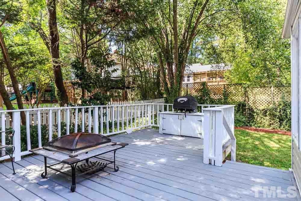 403 Pershing Road Raleigh, NC 27608 - Photo 5 of 20 a view of a chair and table in the deck