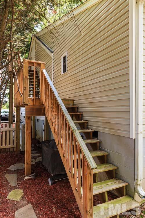 403 Pershing Road Raleigh, NC 27608 - Photo 6 of 20 a view of a house with wooden deck