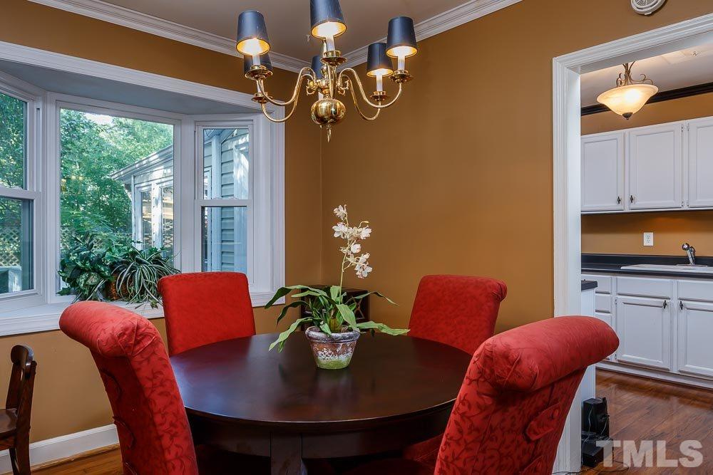 403 Pershing Road Raleigh, NC 27608 - Photo 9 of 20 a view of a dining room with furniture window and outside view