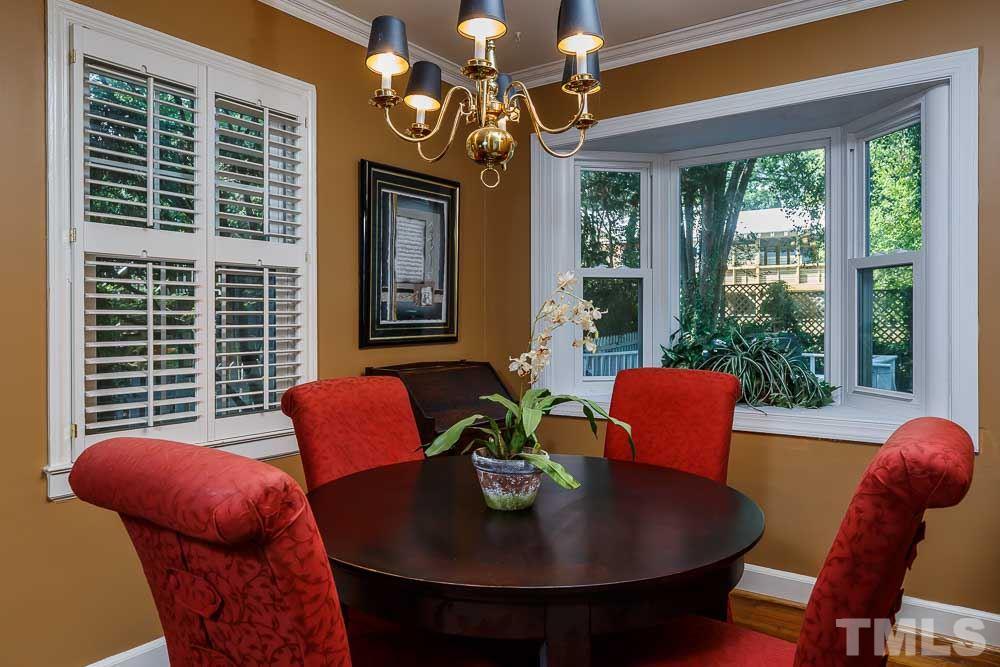 403 Pershing Road Raleigh, NC 27608 - Photo 10 of 20 a view of a dining room with furniture window and outside view
