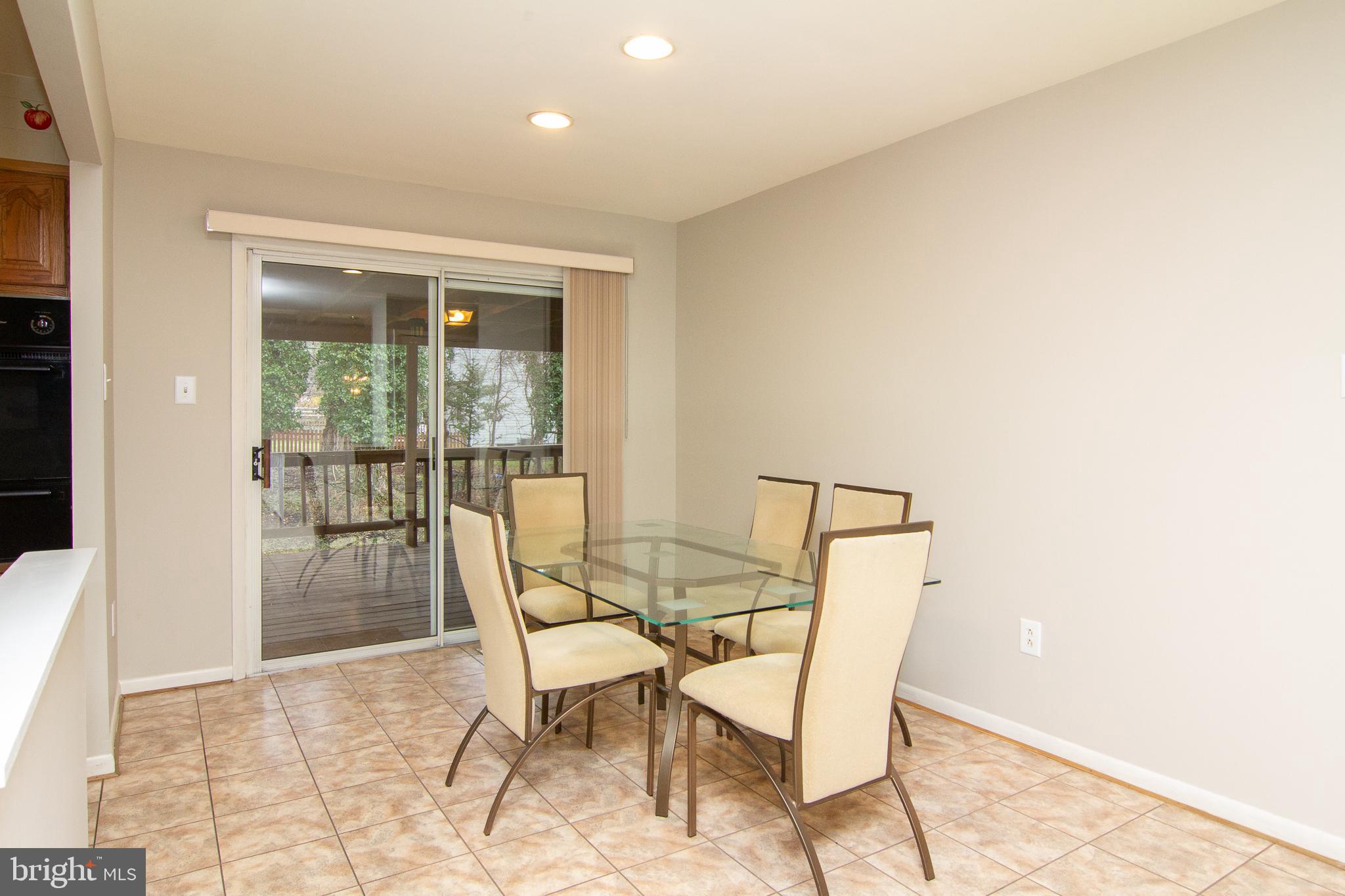 116 Strongwood Road Owings Mills, MD 21117 - Photo 10 of 32 Dining Room With Sliders to Deck