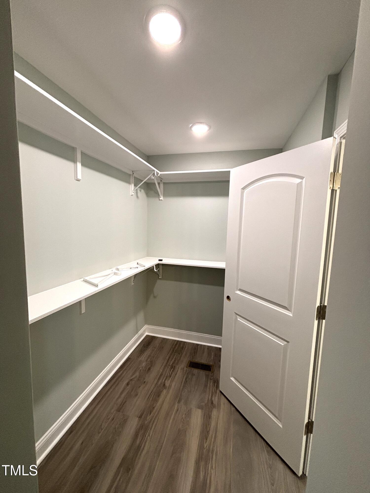 2665 Bodie Currin Road Oxford, NC 27565 - Photo 14 of 26 a view of walk in closet with empty racks