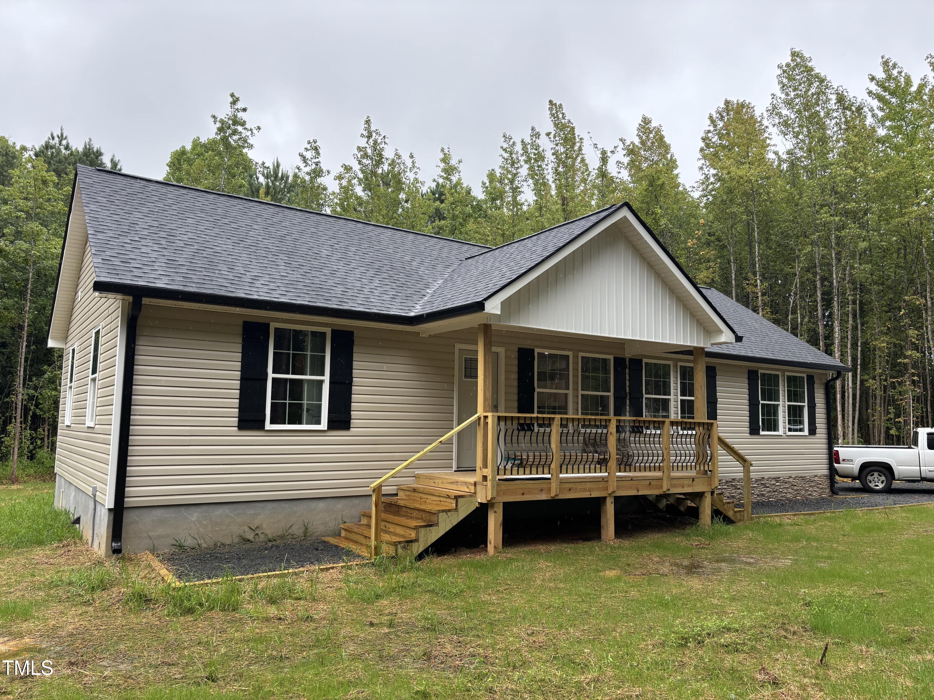 2665 Bodie Currin Road Oxford, NC 27565 - Photo 2 of 26 a view of a house with a yard balcony and slide
