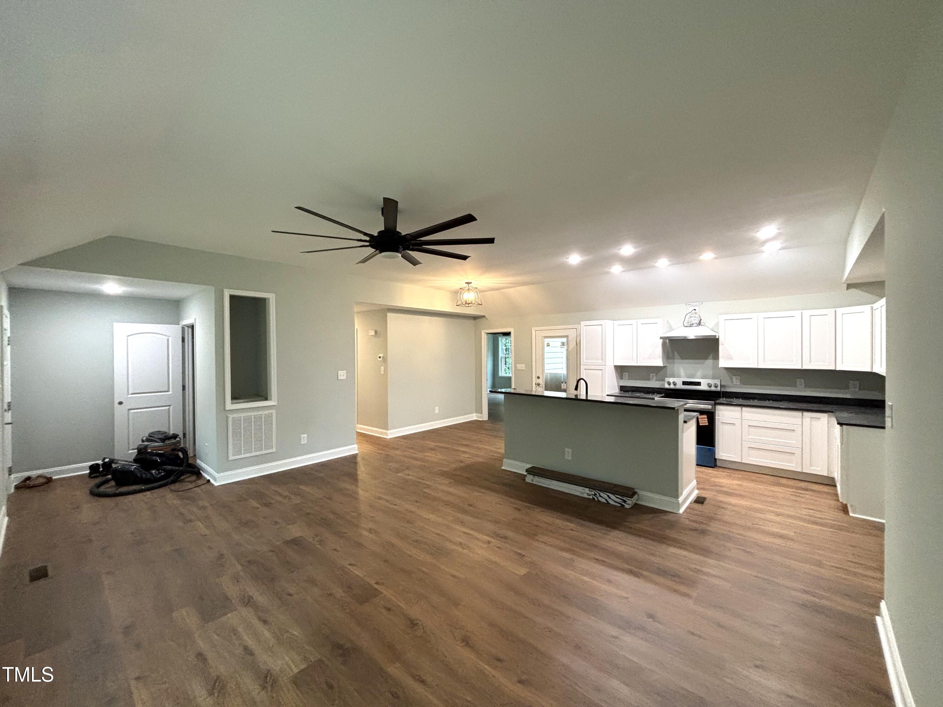 2665 Bodie Currin Road Oxford, NC 27565 - Photo 8 of 26 a view of kitchen with cabinets and wooden floor