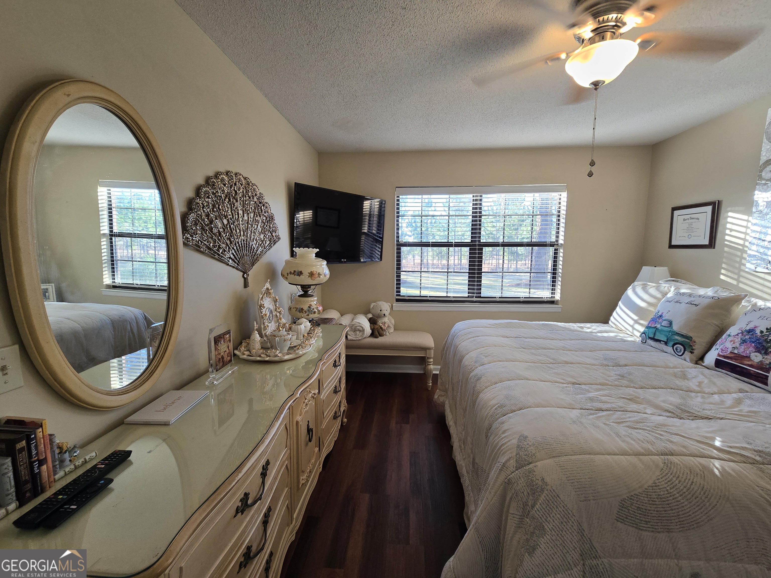 479 Mitchell Loop Bluffton, GA 39824 - Photo 29 of 51 a spacious bedroom with a bed and a chandelier