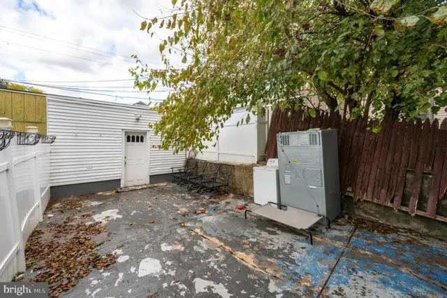 a view of a house with a tree