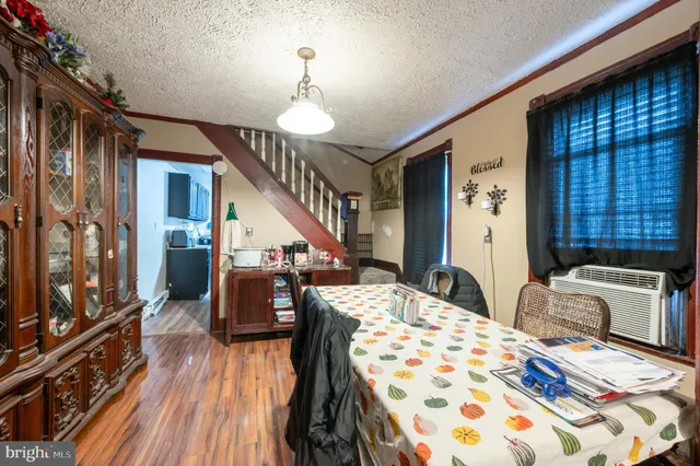 a bedroom with bed and wooden floor