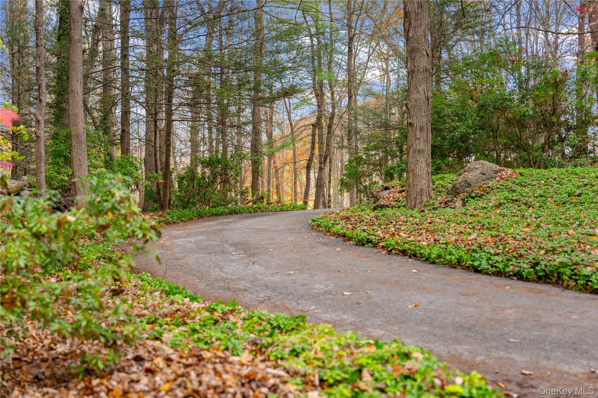 115 Old Roaring Brook Road Mount Kisco, NY 10549 - Photo 17 of 25 front view of a house with a yard