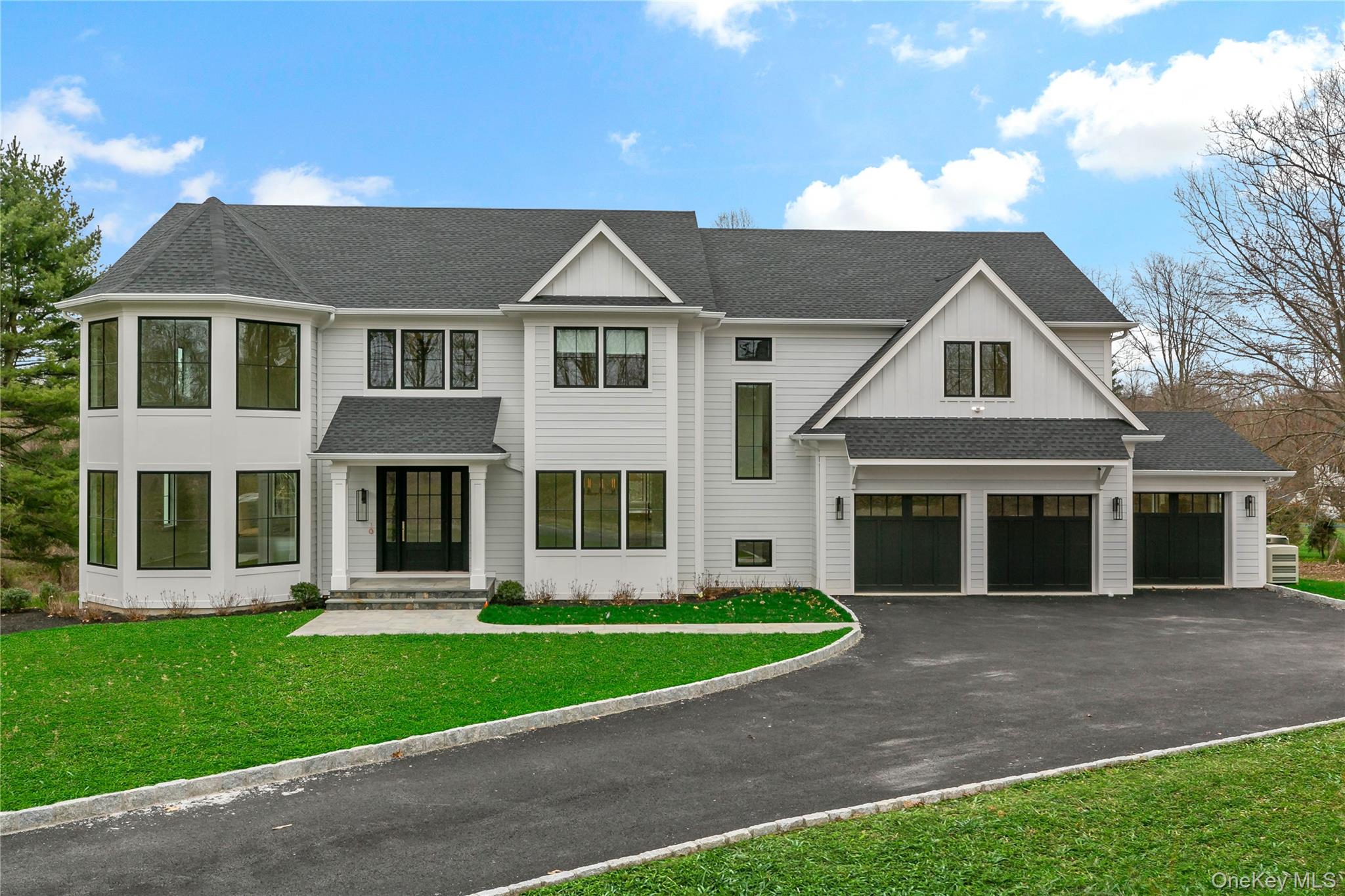 115 Old Roaring Brook Road Mount Kisco, NY 10549 - Photo 7 of 25 a front view of a house with a yard