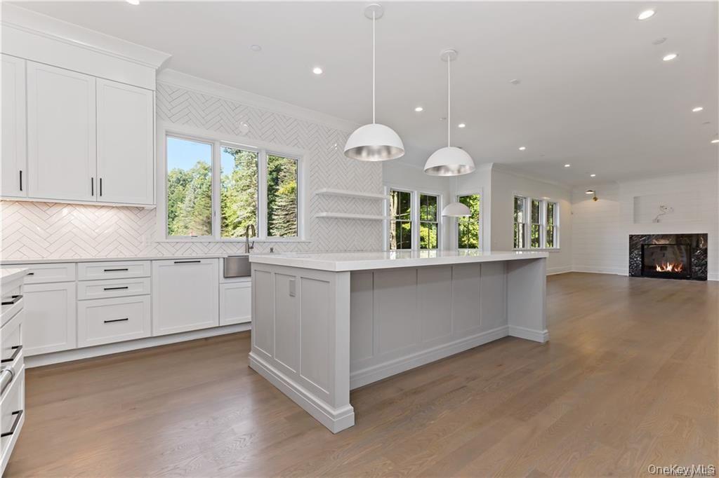 115 Old Roaring Brook Road Mount Kisco, NY 10549 - Photo 10 of 25 a kitchen with cabinets and window