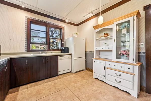 a bedroom with a bed window and a ceiling fan