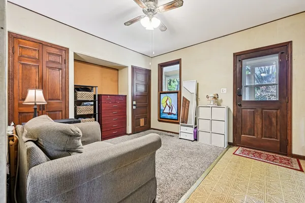 a bedroom with a bed and a chair
