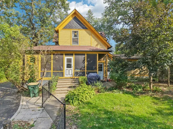 a picture of a bathroom with a shower and a mirror