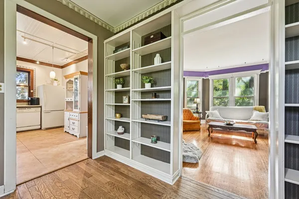 a kitchen with granite countertop a sink and cabinets