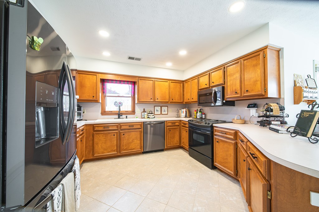 4856 Spring Ridge Drive Columbus, GA 31909 - Photo 11 of 41 a kitchen with stainless steel appliances granite countertop refrigerator sink and stove
