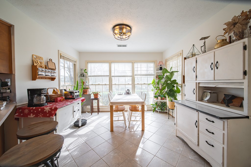 4856 Spring Ridge Drive Columbus, GA 31909 - Photo 17 of 41 a living room with furniture a fireplace and a window