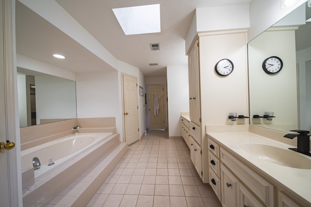 4856 Spring Ridge Drive Columbus, GA 31909 - Photo 21 of 41 a spacious bathroom with a tub sink and mirror