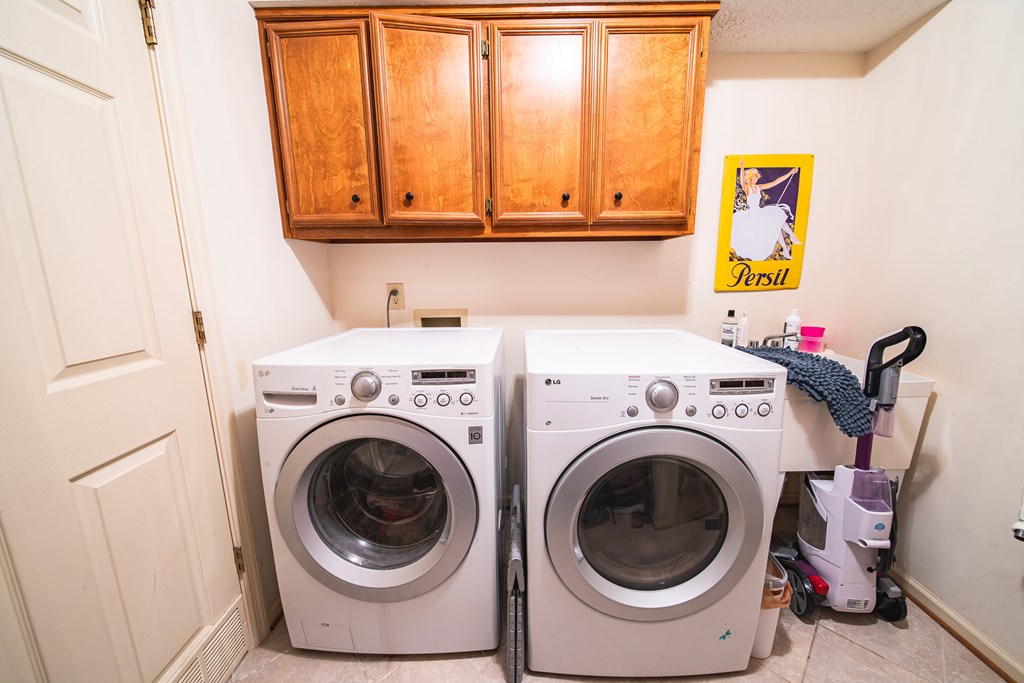 4856 Spring Ridge Drive Columbus, GA 31909 - Photo 34 of 41 a utility room with dryer and washer