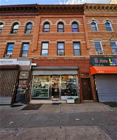 a view of building with glass windows