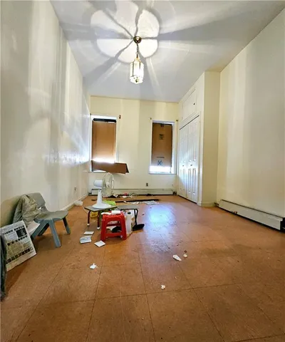 a view of house with backyard and a garden