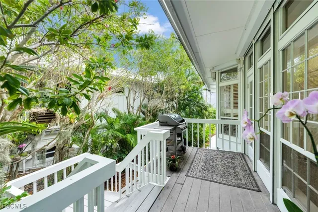 a view of balcony with furniture and garden