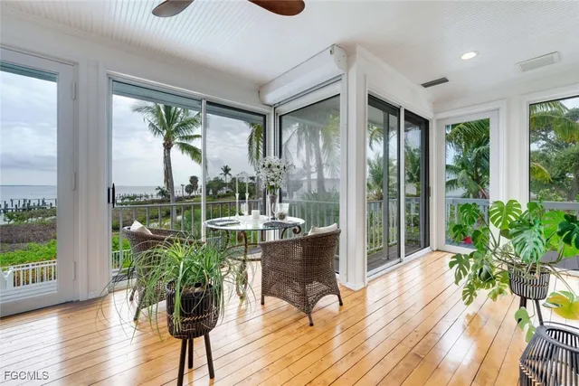 a room with furniture and a potted plant