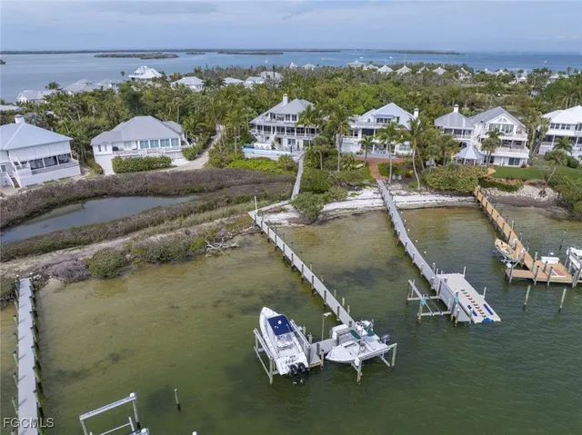 an aerial view of a house with a ocean view